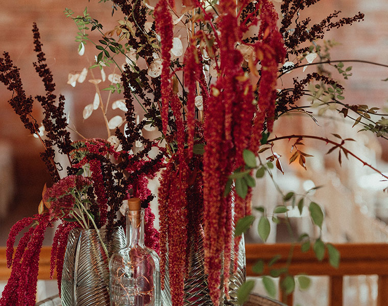 Tall autumn floral display with red amaranthus and seasonal foliage